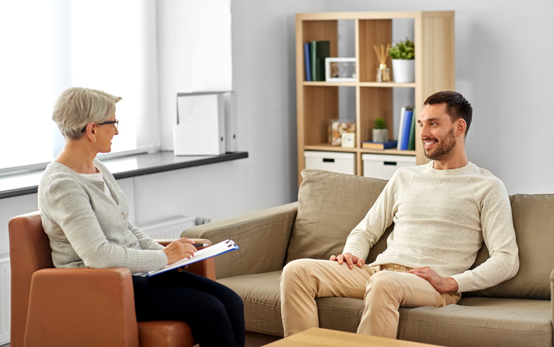 A man at a therapy session with a psychologist